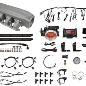 Car engine parts and wiring components display.