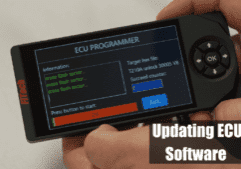 ECU programmer device updating software display.